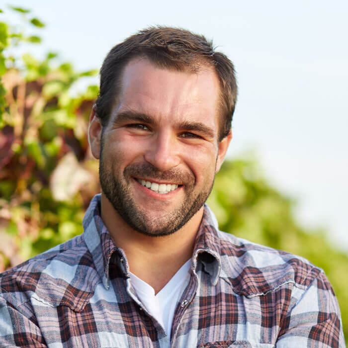 man smiling outdoors