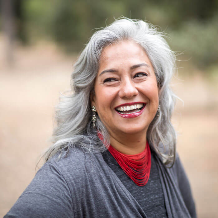 mature woman smiling outdoors